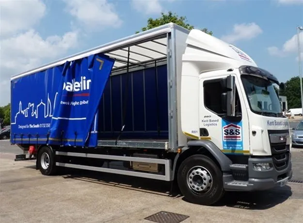 S&S Distribution curtain side lorry with Palletline branding, partially open to show the interior, promoting Kent-based logistics services.
